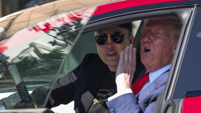 Donald Trump selects new Tesla car model S on White House driveway to show support for Elon Musk